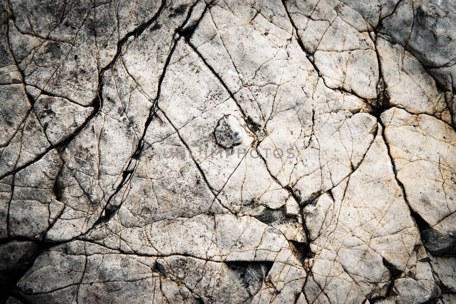 detail a groove on the surface of an old limestone by Ahojdoma