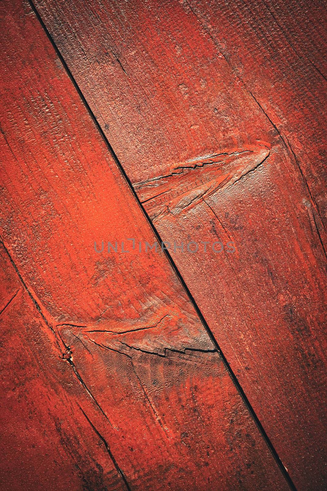 Detail of a wood board with a red paint by Ahojdoma