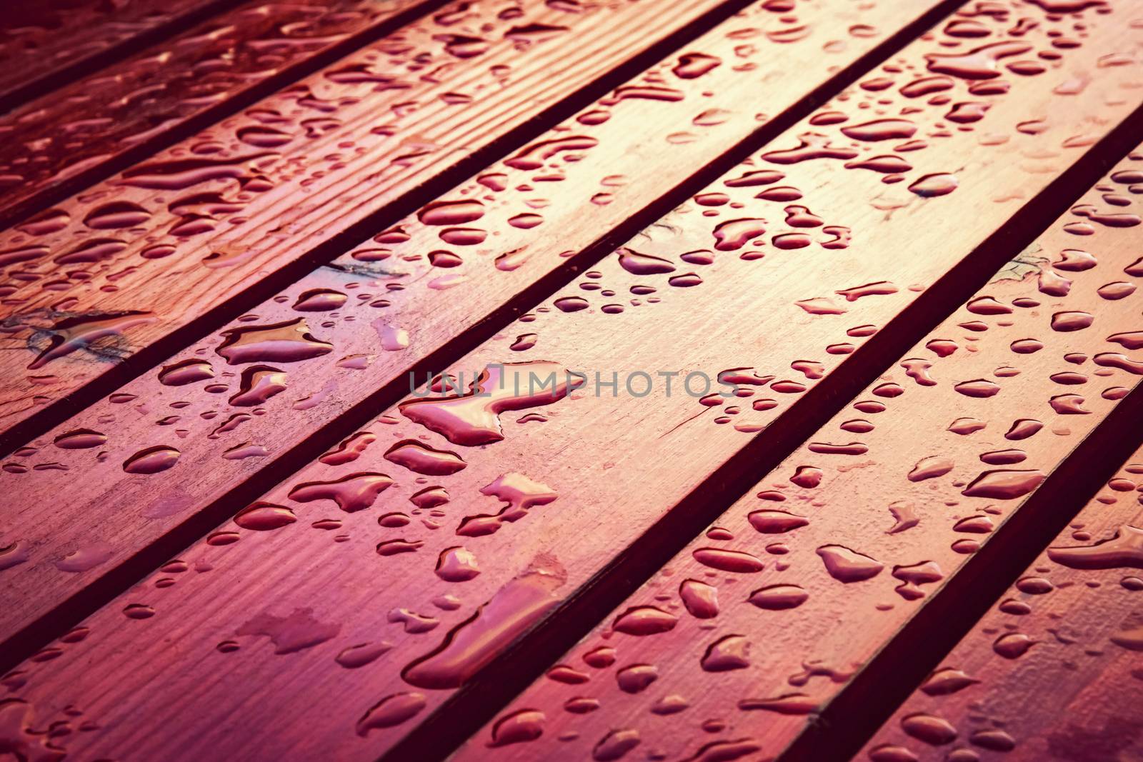 drops of water on a wooden table by Ahojdoma