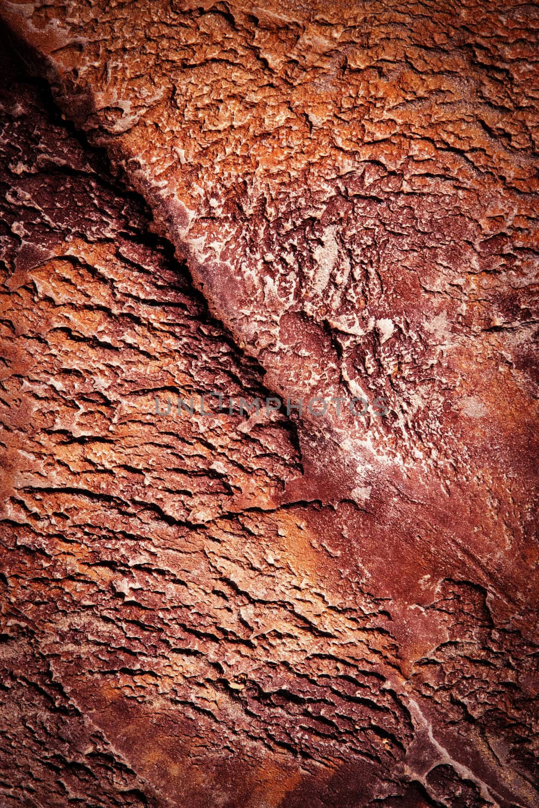 wrinkled surface of red stone by Ahojdoma