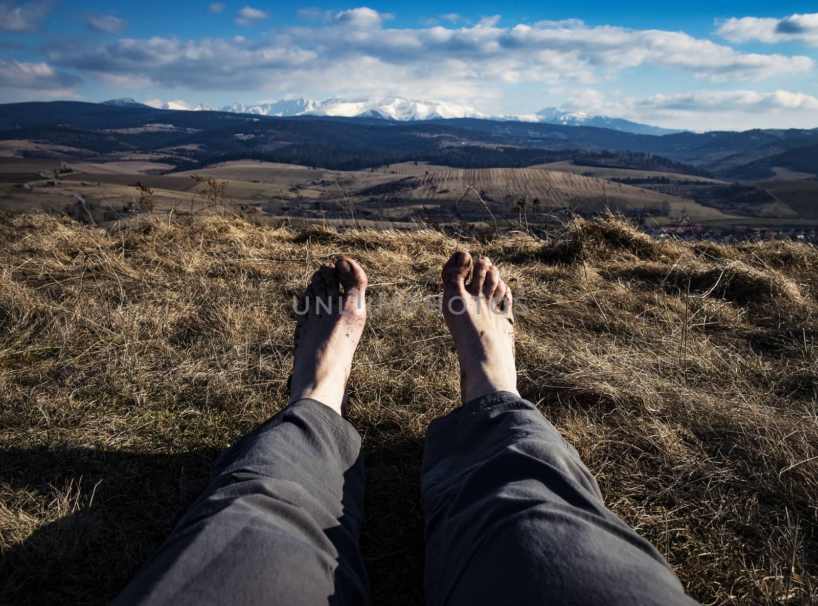abstract bare feet with landscape in background