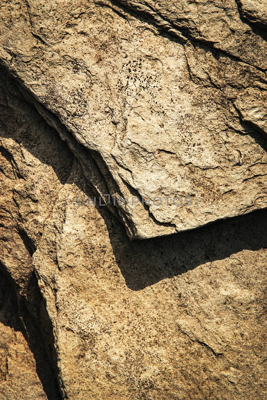 detail of dark rocks with shadow by Ahojdoma