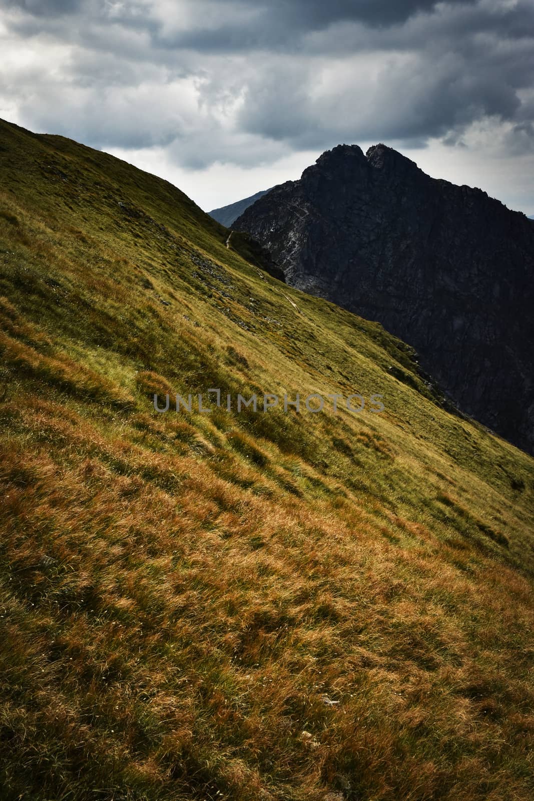 a dramatic landscape in the mountains by Ahojdoma