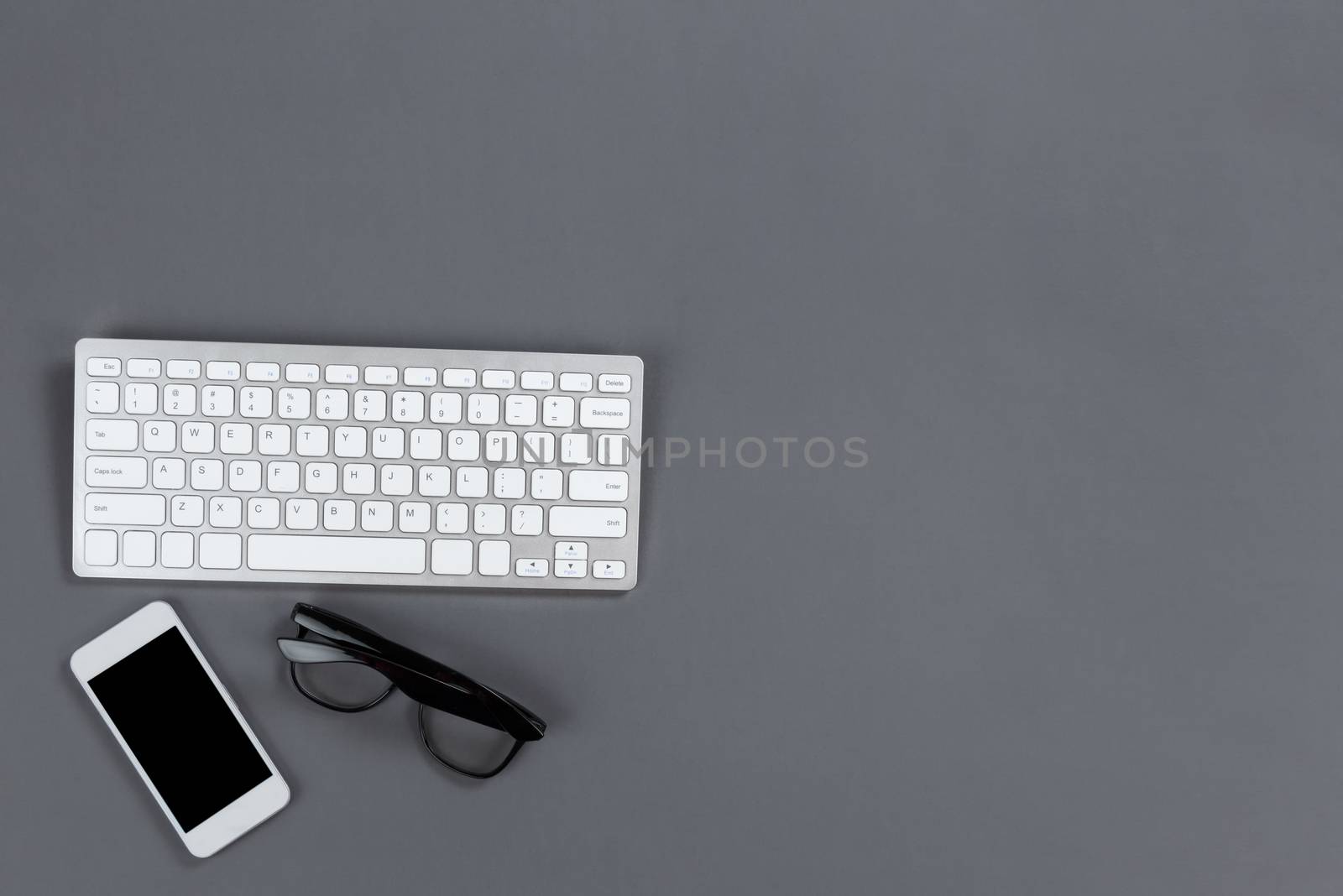 Modern work items on a gray desktop top with copy space 