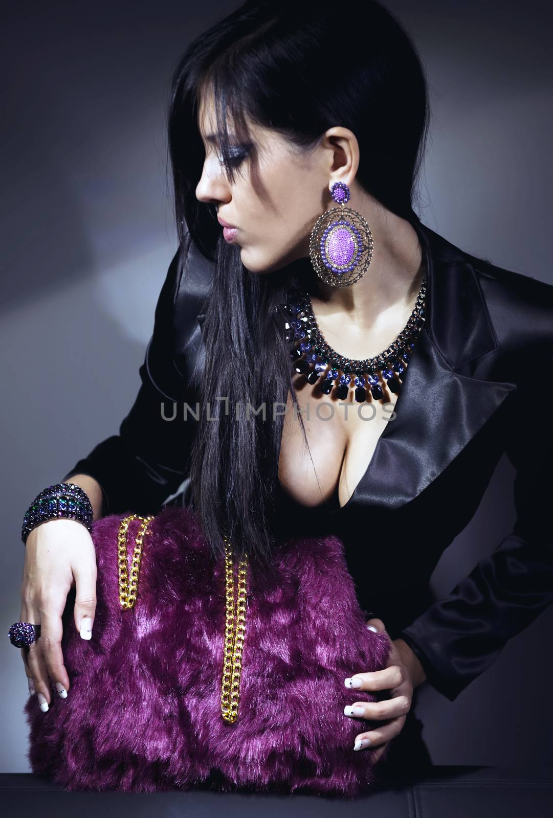 Fashion beautiful woman in evening dress, jewels and bag by lussoadv