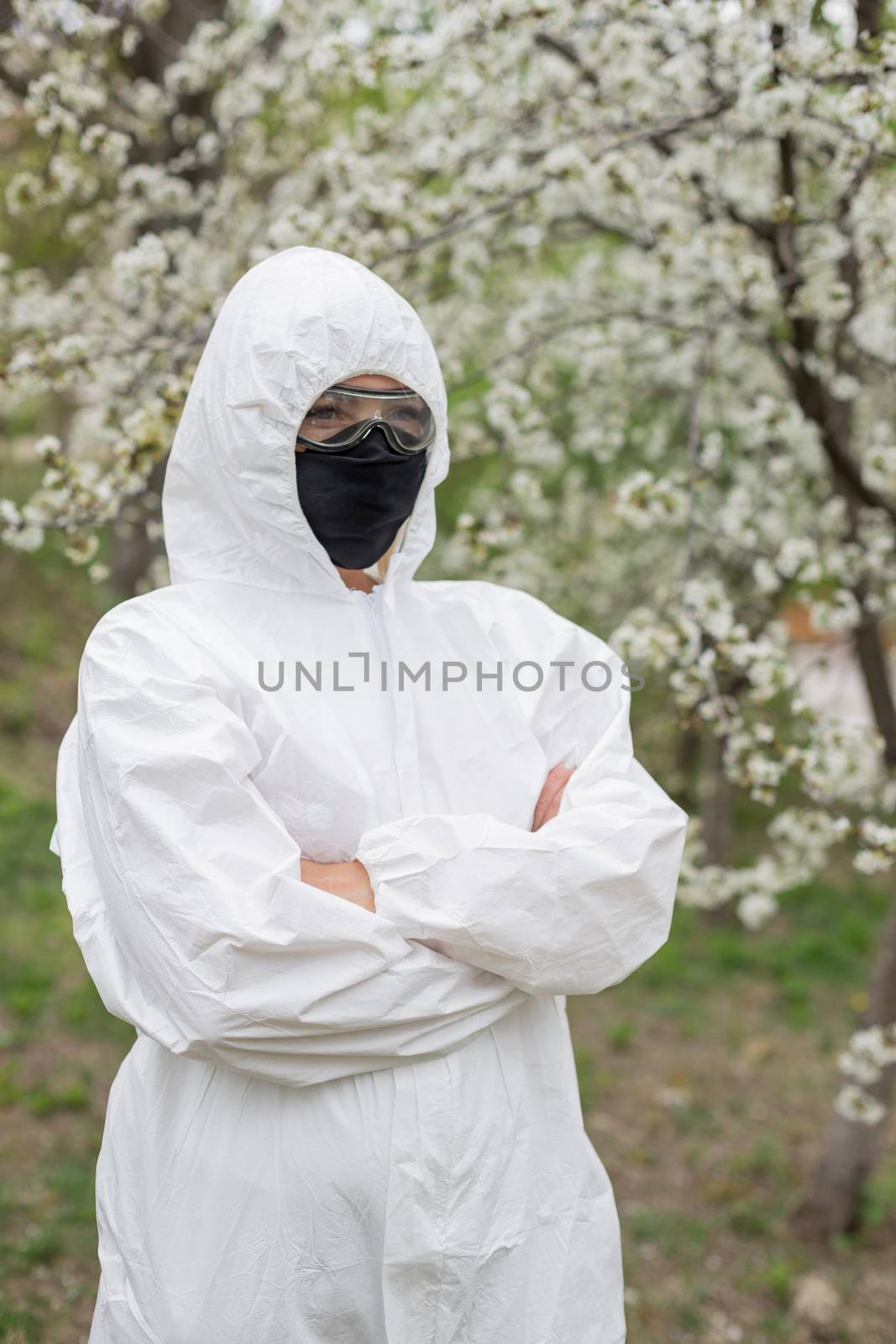 Woman in black mask and white protective suit inspring by Angel_a