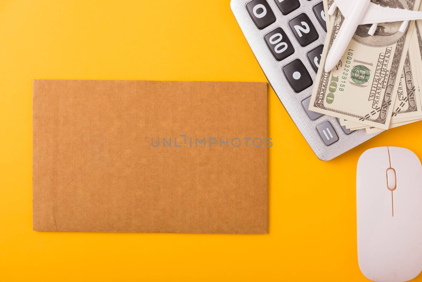 April of the year is Tax Day, Top view flat lay closeup calculator and Dollar money, on yellow background business finance budget concept with copy space for text