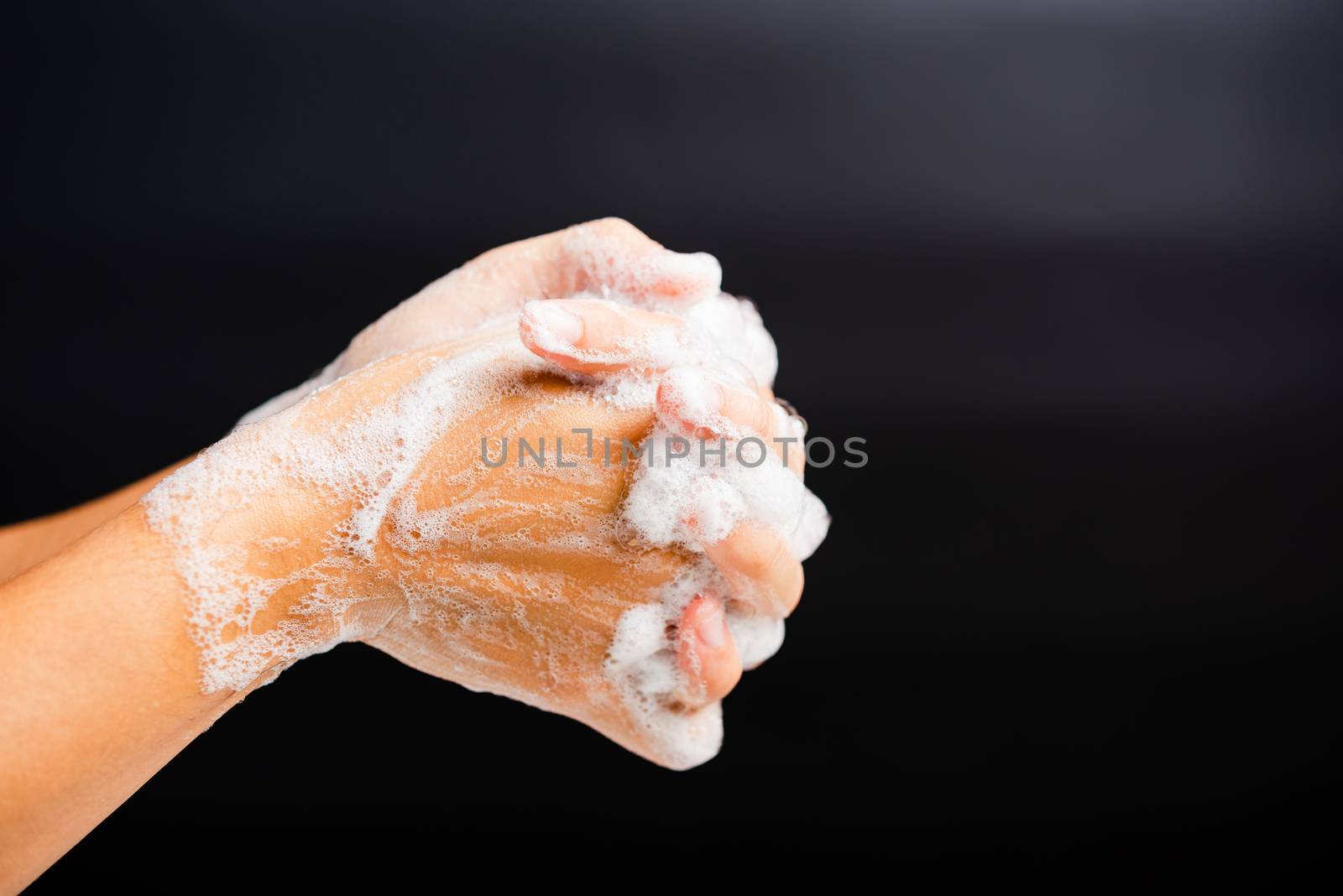 Closeup body care Asian young woman washing hands with soap have foam, hygiene prevention COVID-19 or coronavirus protection concept, isolated on black background