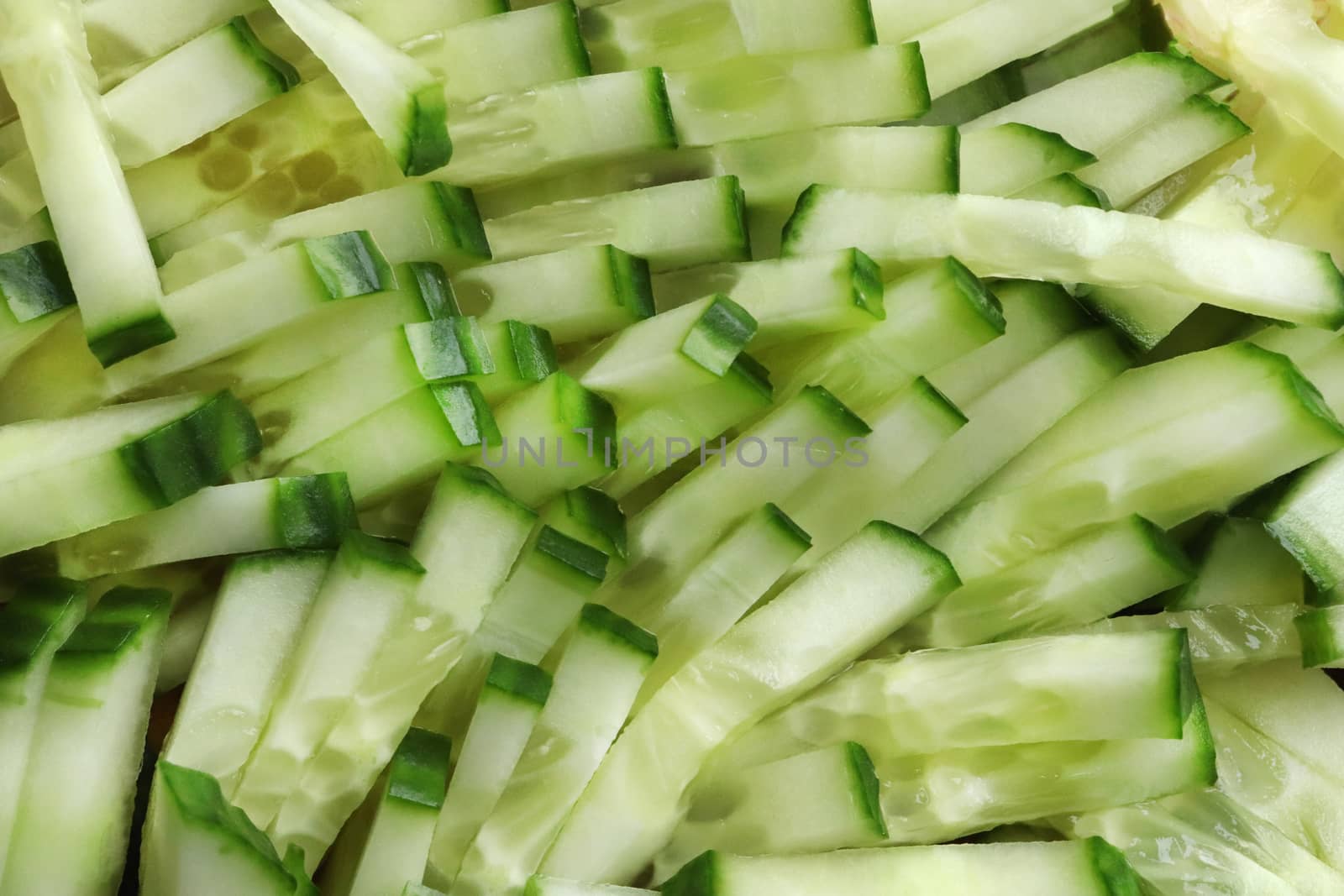 Diced salad ingredient texture. Fresh vitamin backdrop. Sliced cucumber background.