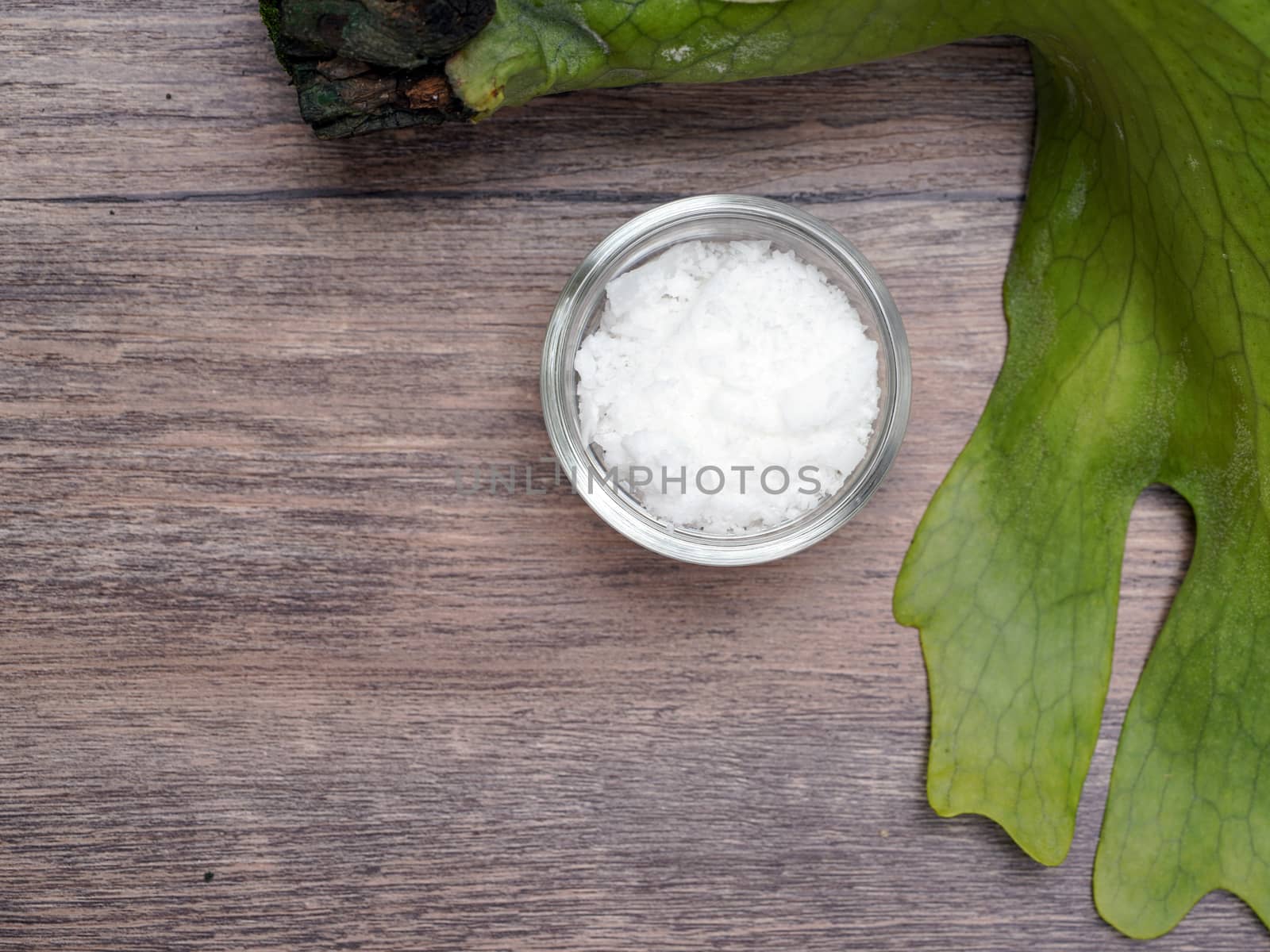 Cetyl esters wax - Cosmetic chemicals ingredient on wooden table by chadchai_k