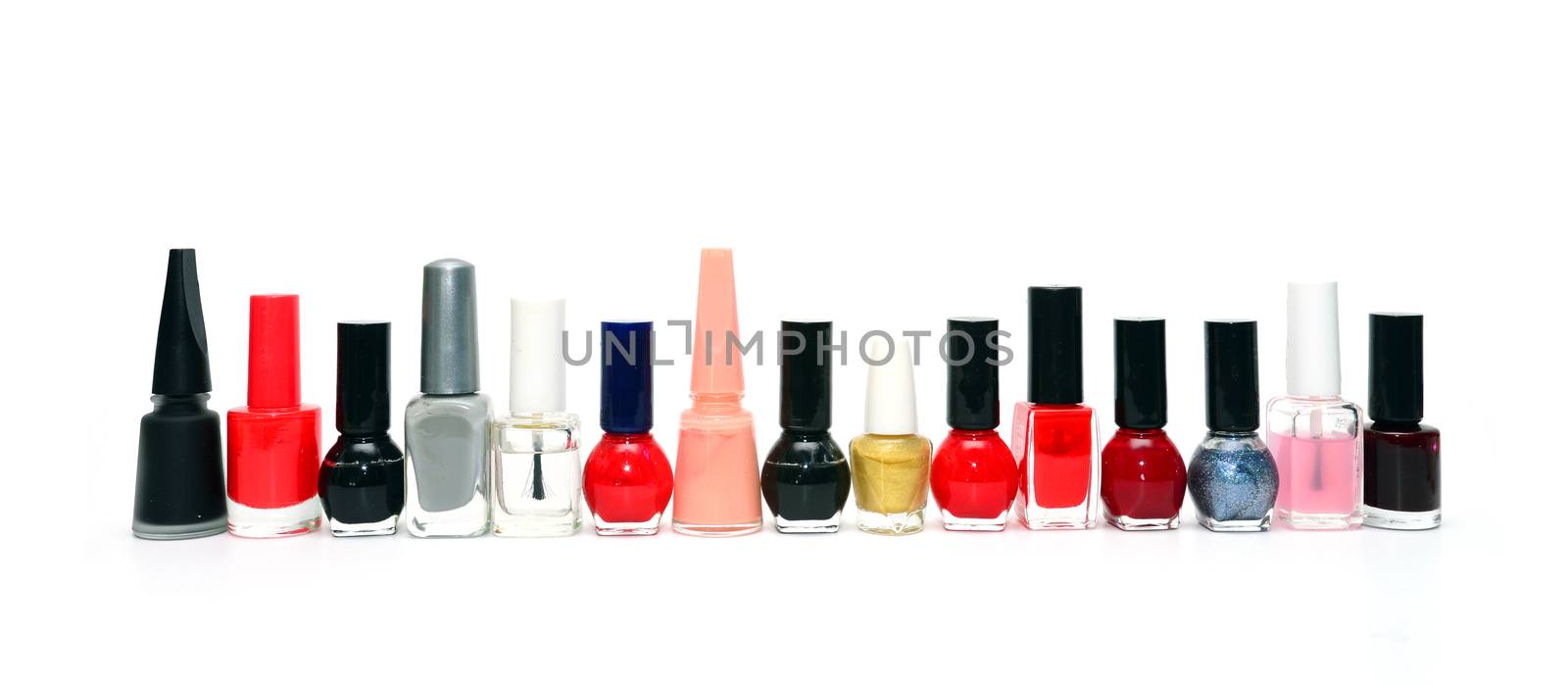 nail polish bottles in a row over white background