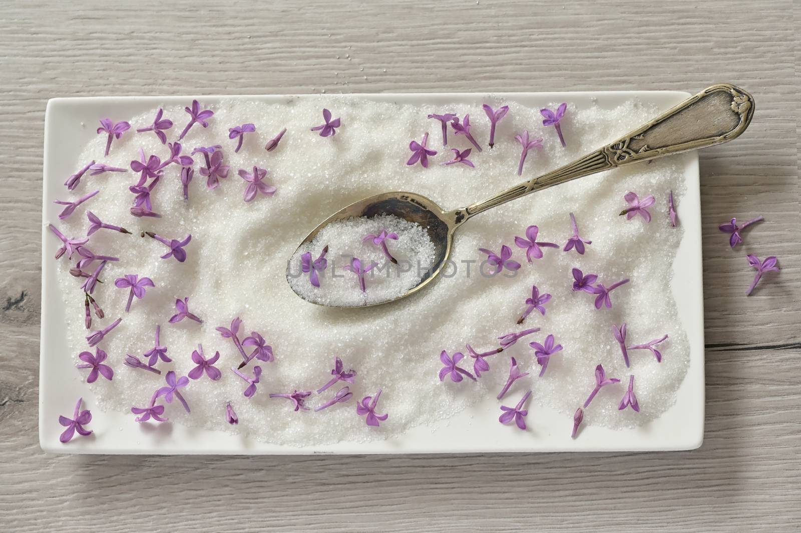 Lilac Sugar In Spoon On WoodenTable by mady70