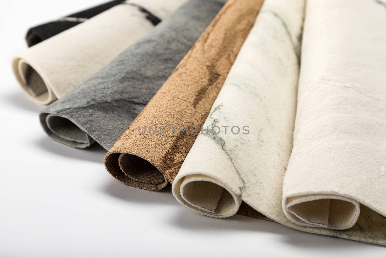Samples of decoration material for the walls of a flexible stone on a white background.