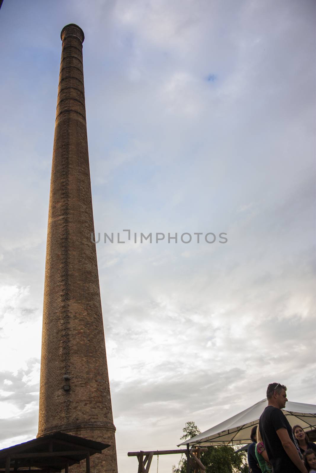 LOREO, ITALY 24 MARCH 2020: Ancient industrial chimney in Loreo, Italy
