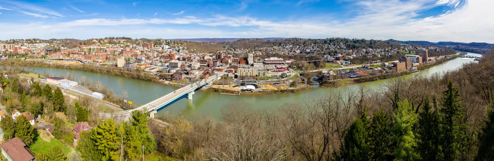 Aerial wide panoramic view of the downtown area of Morgantown WV and campus of West Virginia University taken from a drone above the city