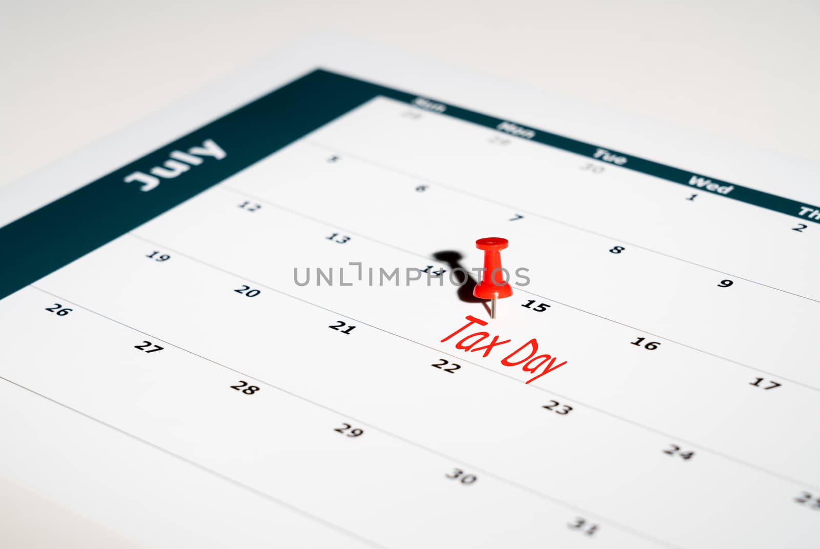 Reminder for sending income tax return for July 15 2020 tax day due to Covid-19 virus delay using calendar page and pin
