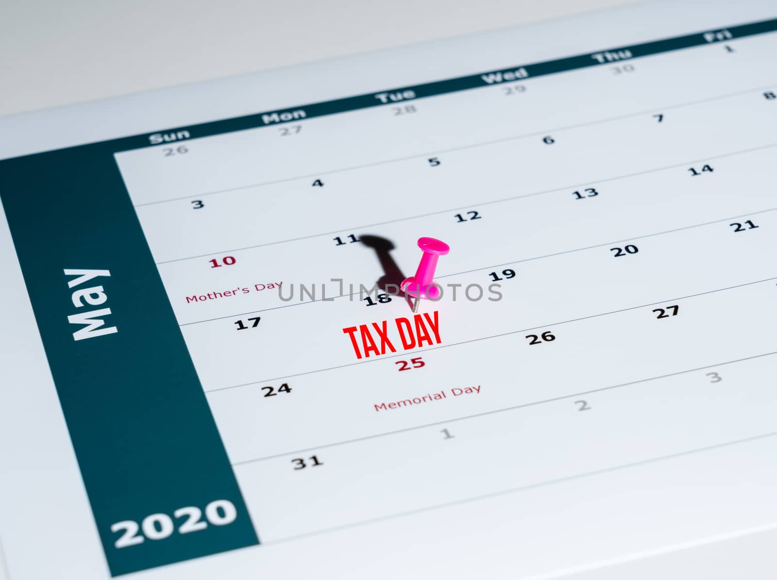 Reminder for sending income tax return for May 18 2020 tax day due to Covid-19 virus delay using calendar page and pin