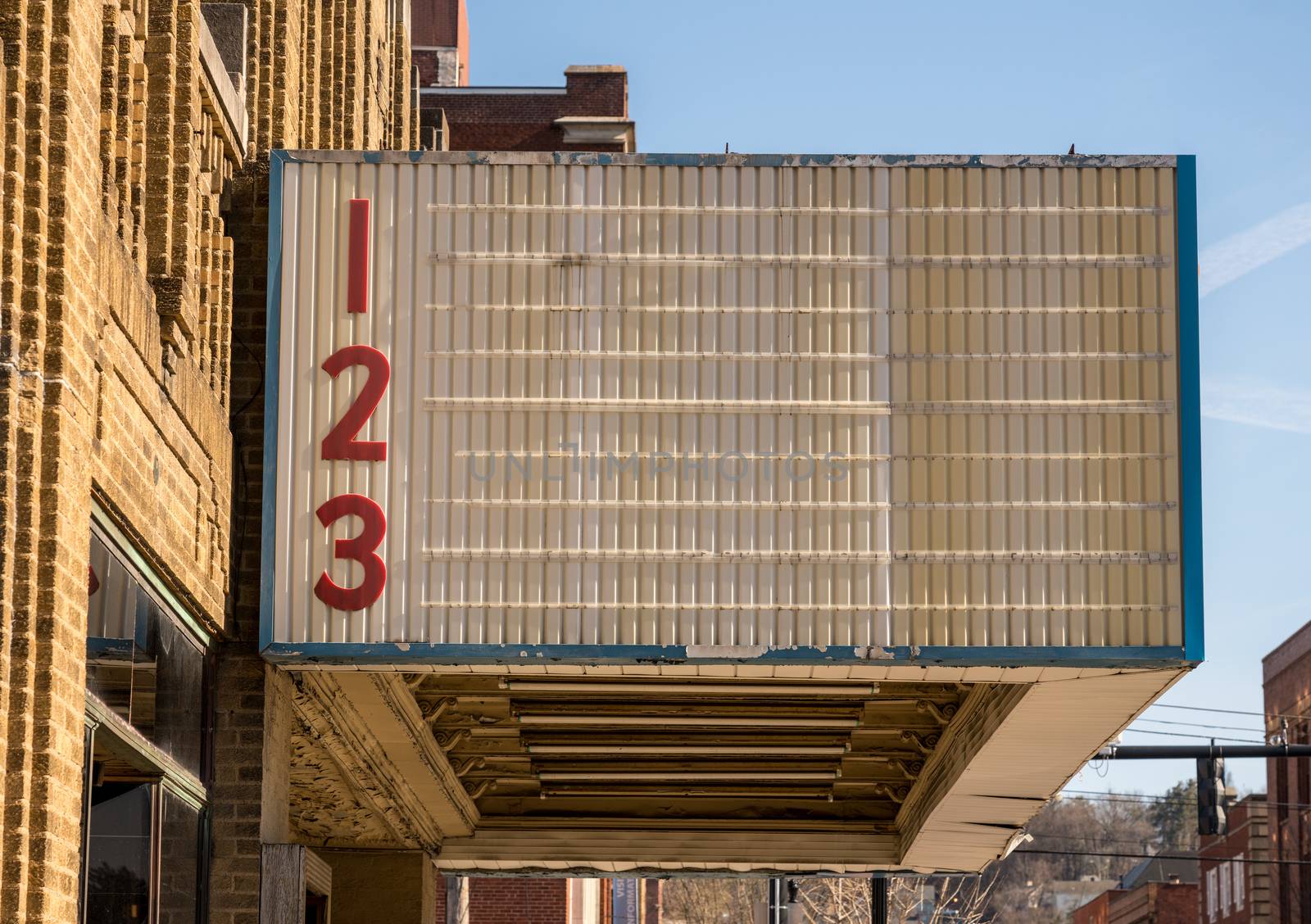 Blank movie cinema billboard or marquee sign in typical USA High street in downtown city