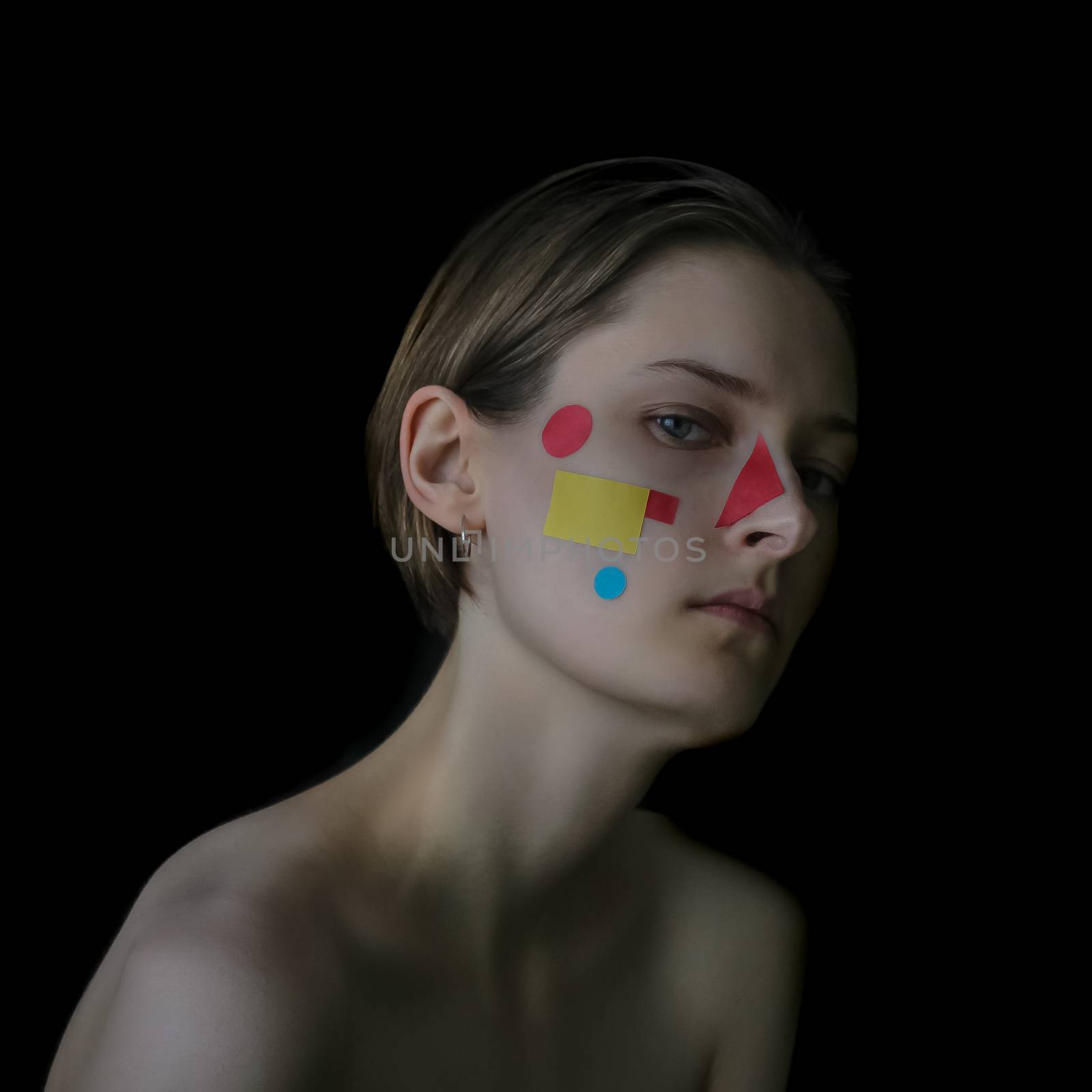 Portrait of a girl on an artistic theme. Geometric objects