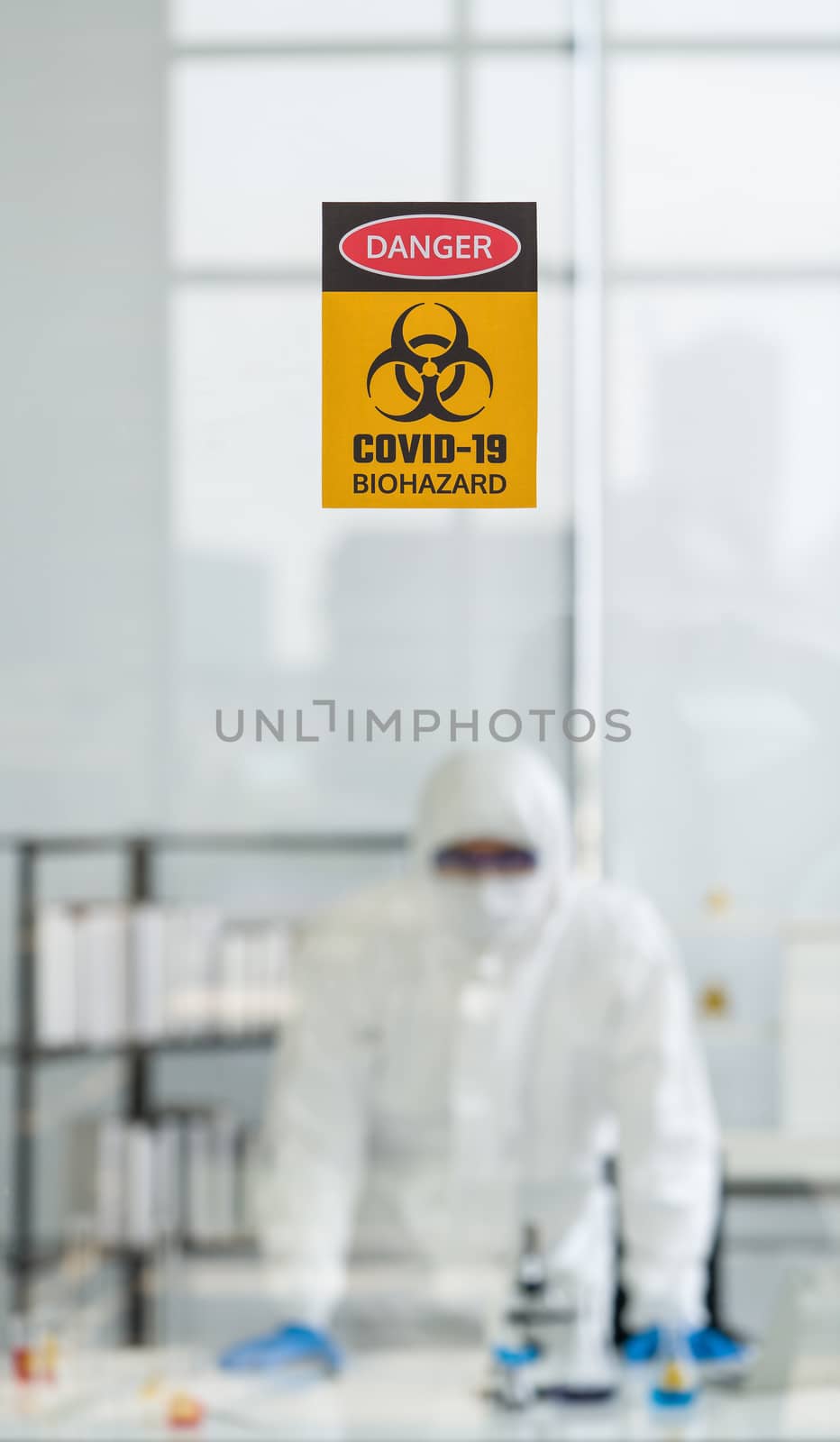 Photos taken through the glass of the lab room preventing the spread of virus research.