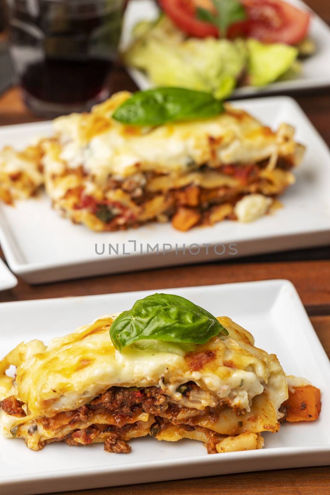 closeup of lasagna with basil