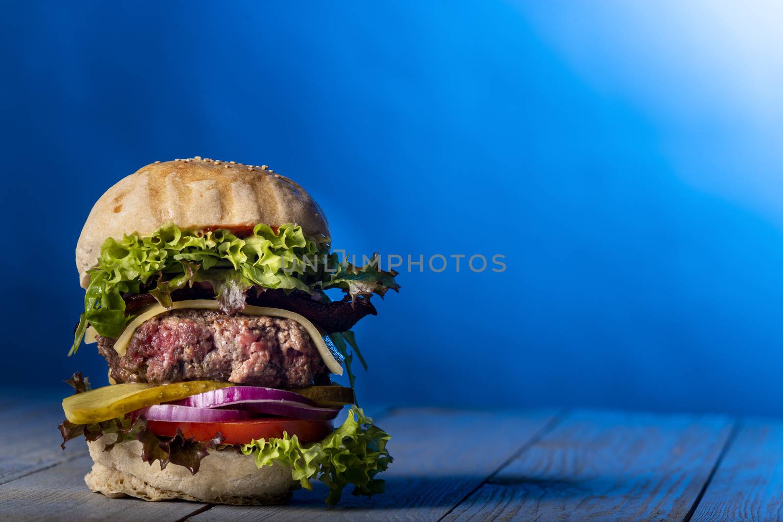 closeup of a single cheeseburger