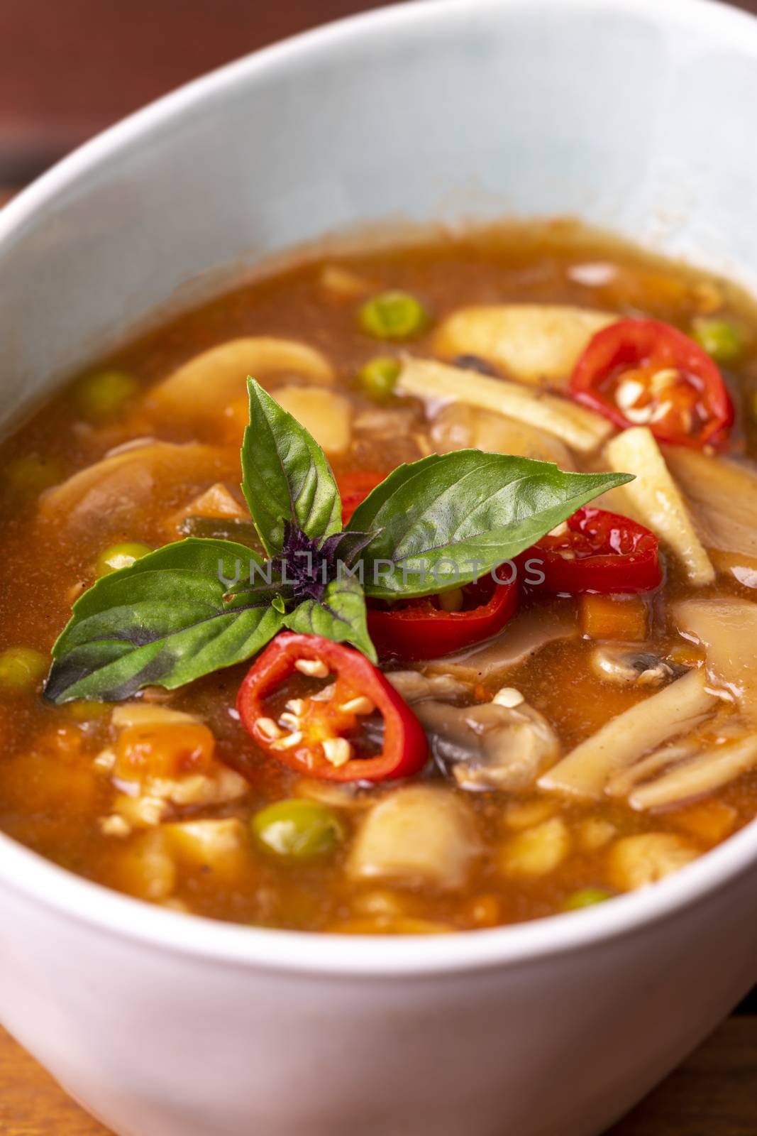 chinese sweet and sour soup on wood