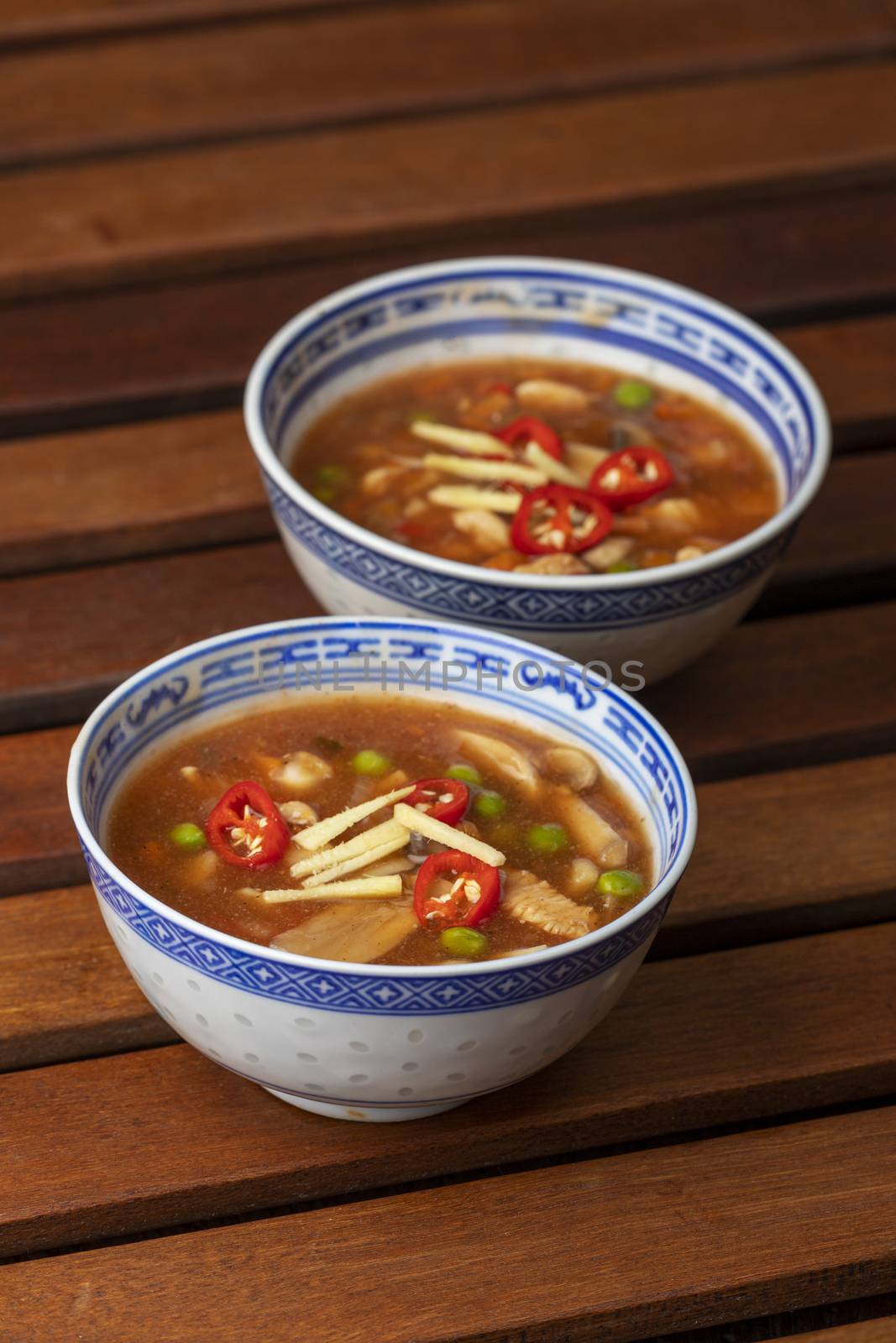 chinese sweet and sour soup on wood