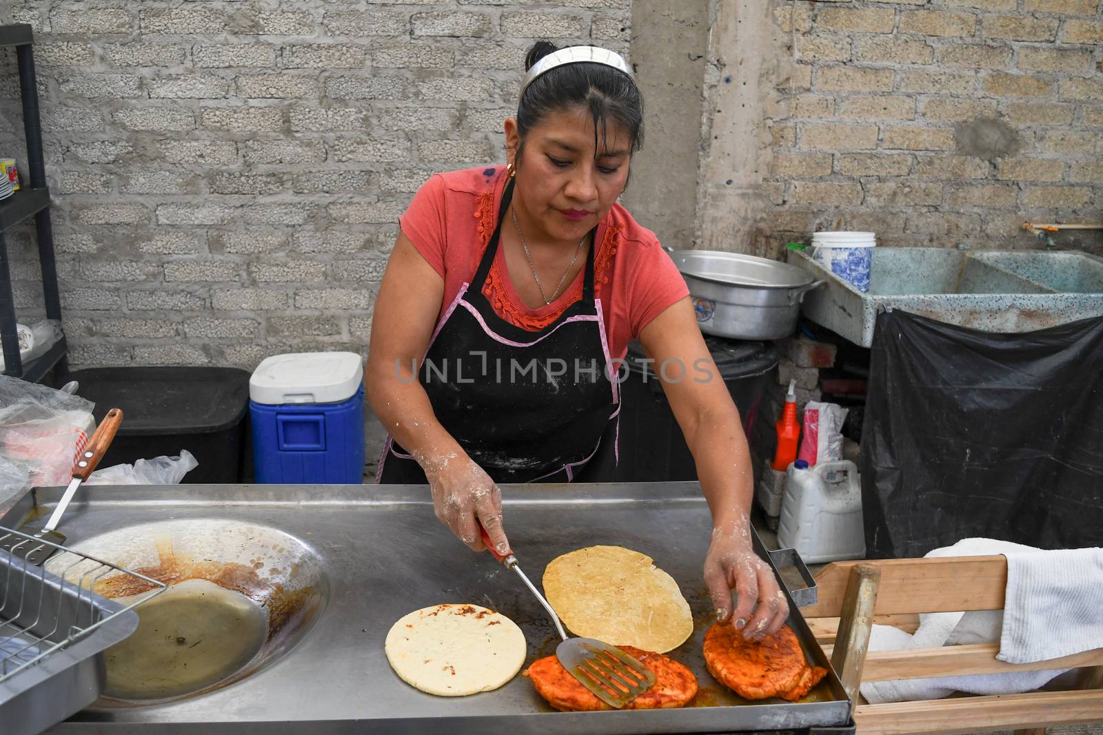 Old woman preparing a typical mexican food with her own hands