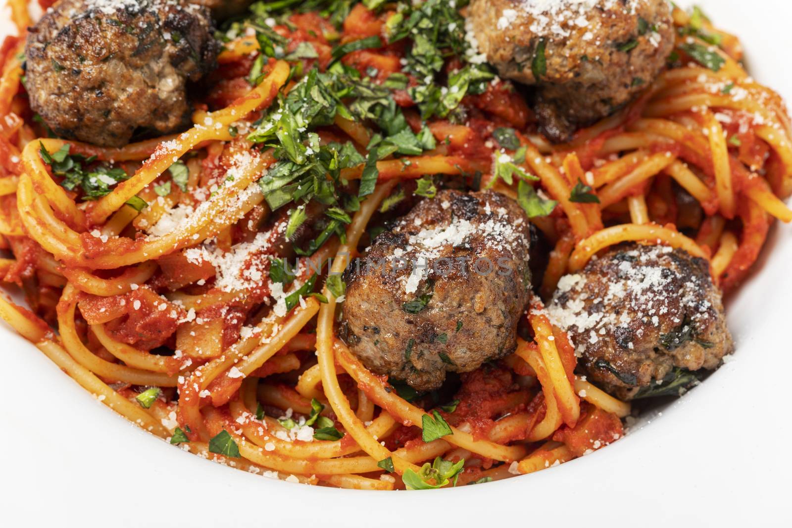 spaghetti with meat balls on dark wood