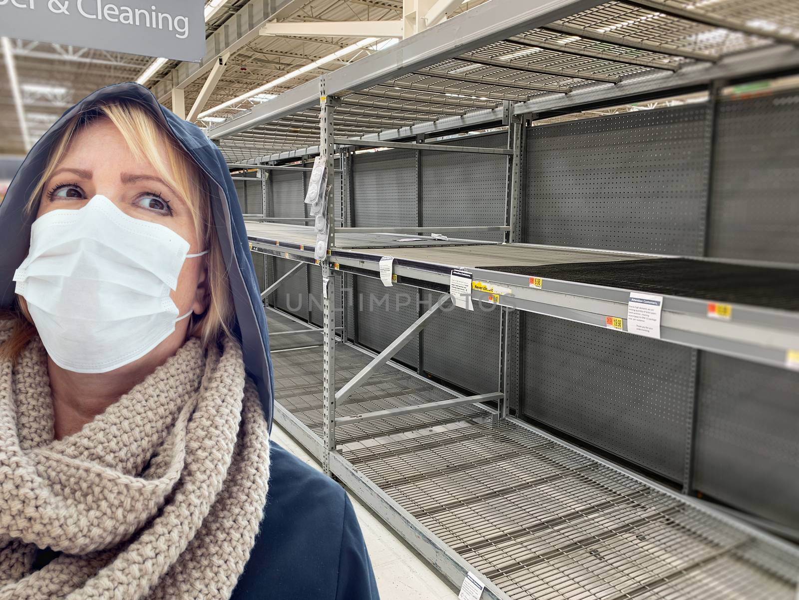 Young Woman Wearing Medical Face Mask In Empty Aisle of Grocery Store.