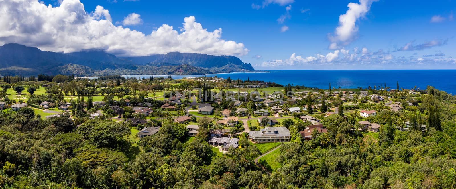 Aerial panorama of Princeville and Bali Hai with Hanalei Bay in Kauai in the distance