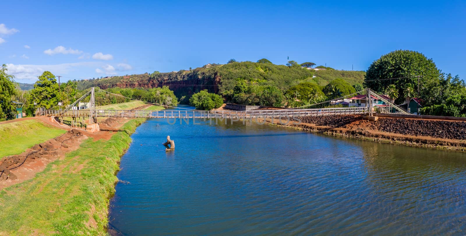 Aerial drone view of the wooden swinging bridge of Hanapepe over the river on Kauai
