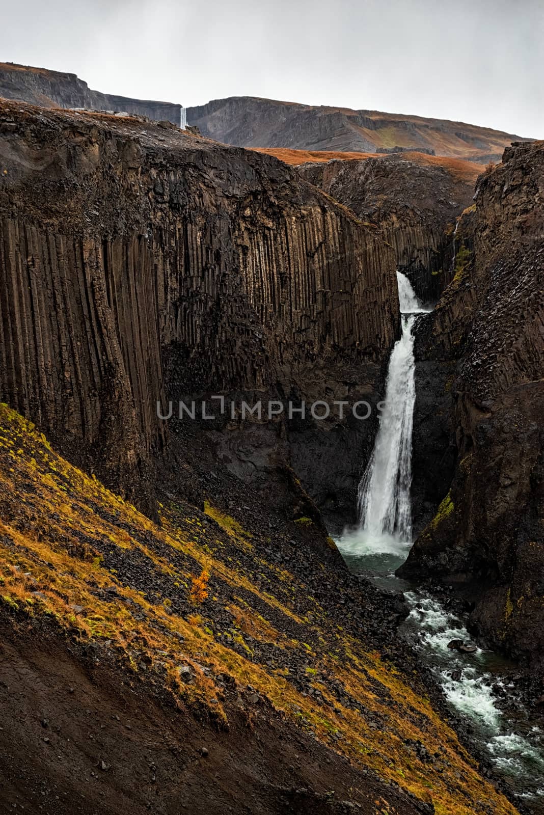 Hengifoss and litlanesfoss waterfalls in eastside of Iceland in a cloudy day