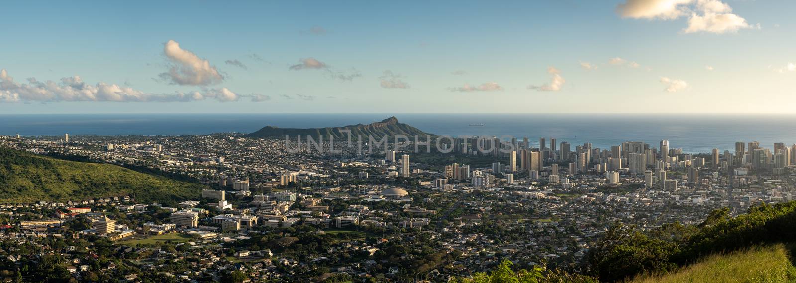 Wide panoramic image of sunset over Waikiki, Honolulu and Diamond Head from the Tantalus Overlook on Oahu, Hawaii