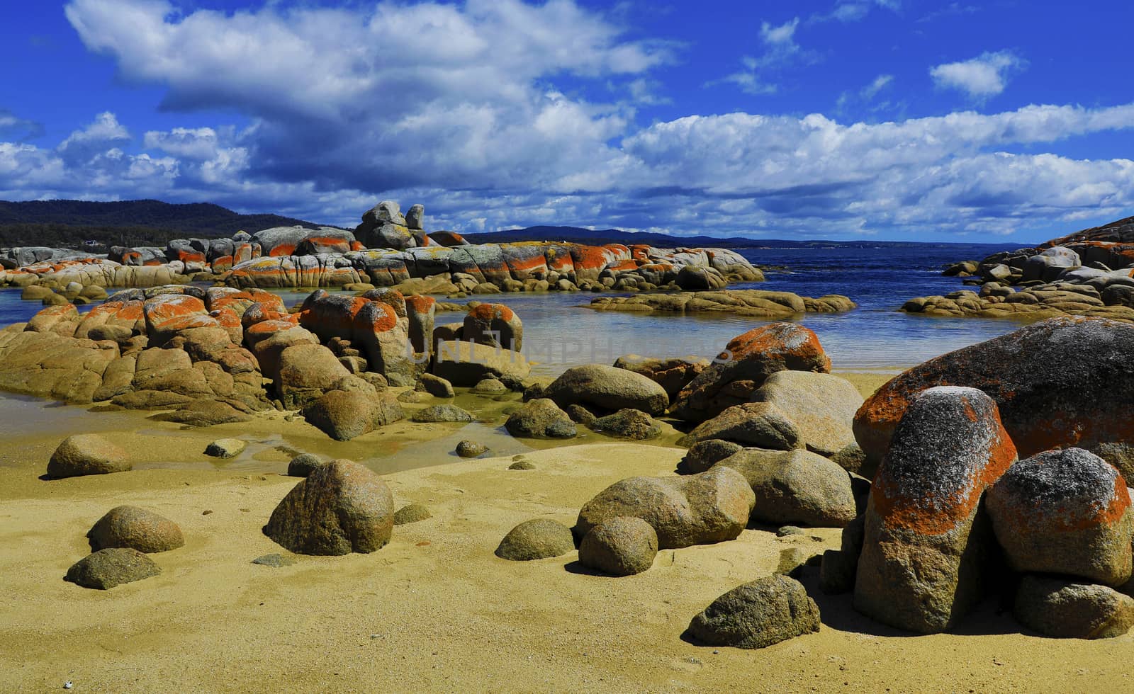 australian seascape at sunrise with rich in red color cloud formation