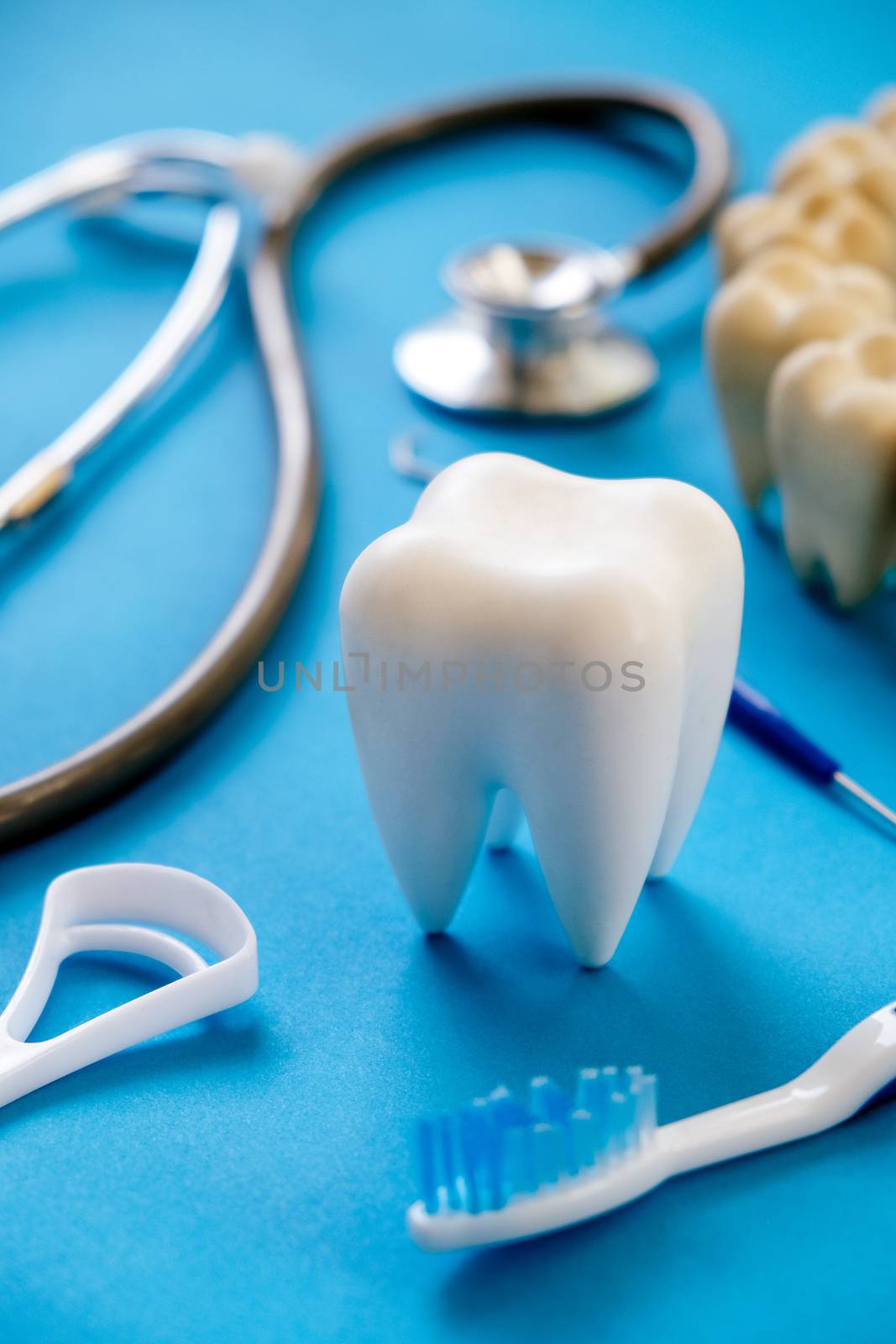 Dental model and dental equipment on blue background, concept image of dental background. dental hygiene background