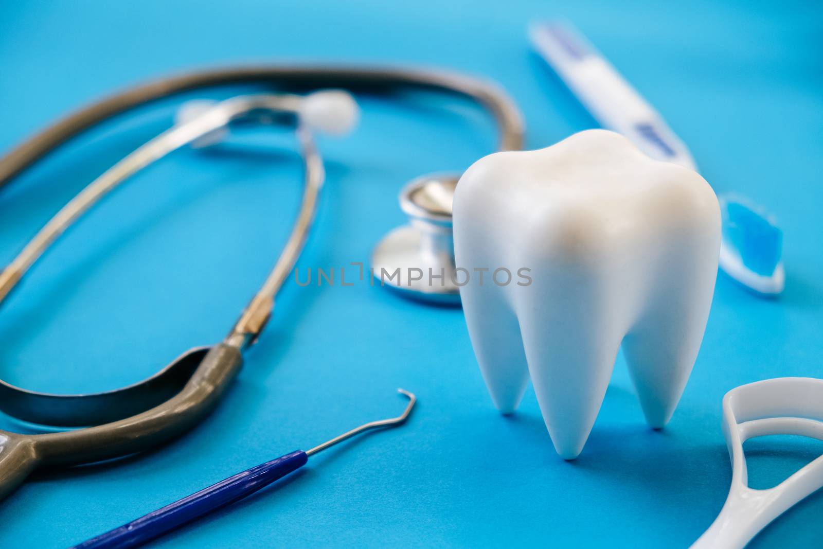 Dental model and dental equipment on blue background, concept image of dental background. dental hygiene background