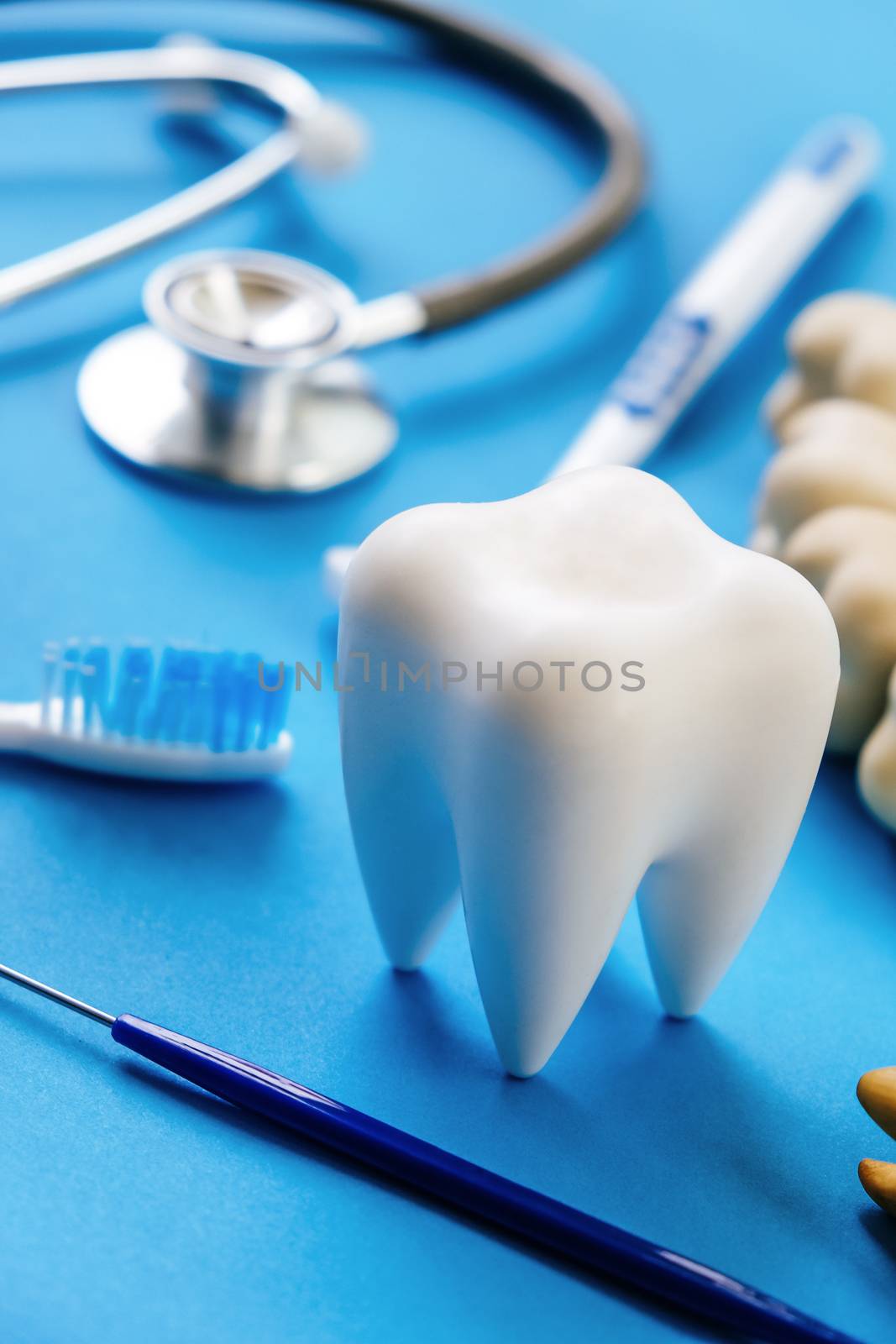 Dental model and dental equipment on blue background, concept image of dental background. dental hygiene background