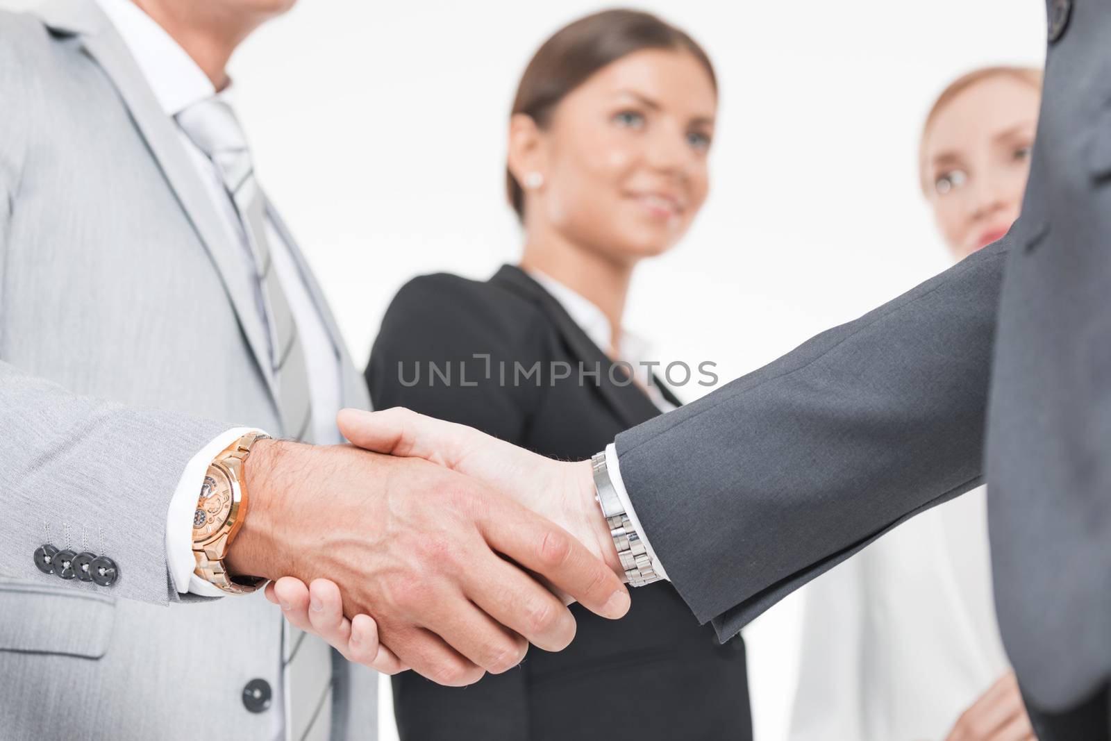 Business handshake of business people team on white