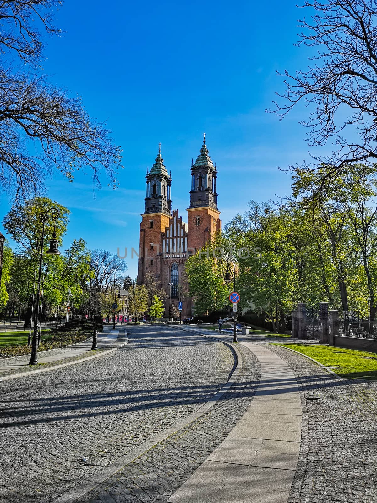 Colorful cathedral square in front of basilica of Saint Peter and Paul in Poznan city at sunny morning by Wierzchu