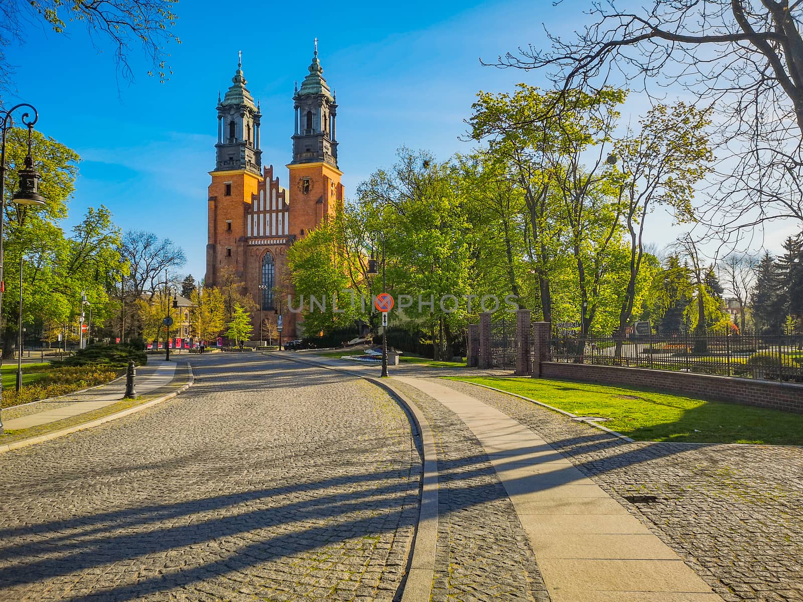Colorful cathedral square in front of basilica of Saint Peter and Paul in Poznan city at sunny morning