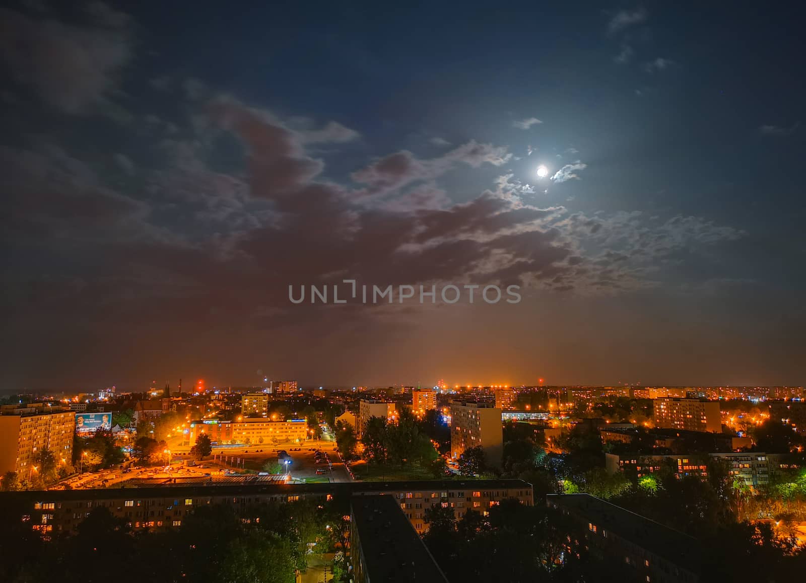 Cityscape of Full moon cloudy night over Wroclaw city