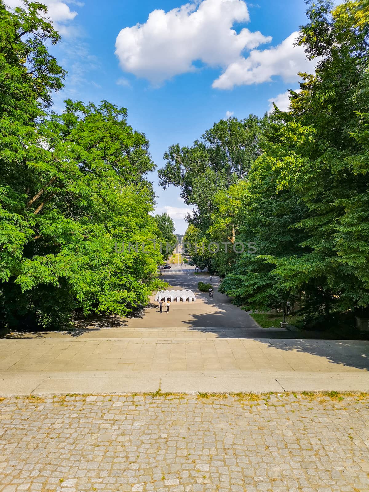 Long Walkway with concrete stairs with metal construction at sunny cloudy day