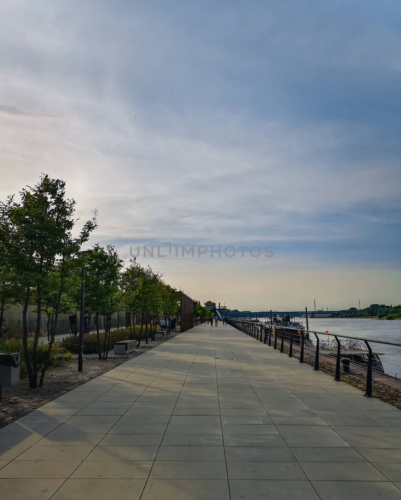 Walk by boulevard at cloudy sunny afternoon in Warsaw Vistula Boulevard