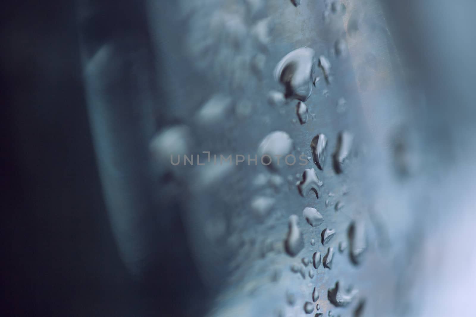 beads of water on a black background