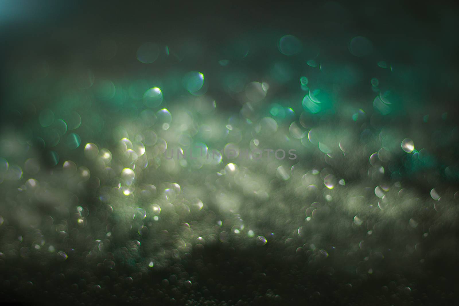 Abstract compositione in green bokeh on black  background