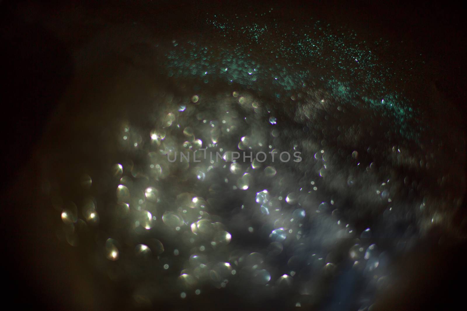 abstract background composed of silver and blue bokeh