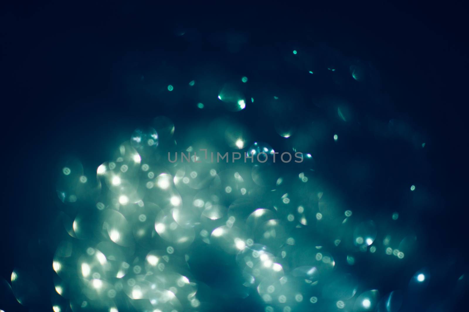 Abstract compositione in blue bokeh on black  background