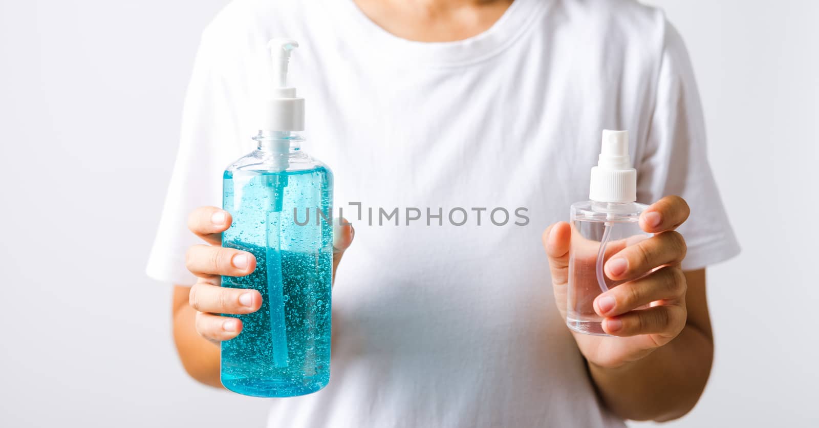 Asian young woman holding show dispenser sanitizer alcohol gel pump and spray bottle on hand wash cleaning, hygiene prevention COVID-19 or coronavirus protection concept, isolated on white background